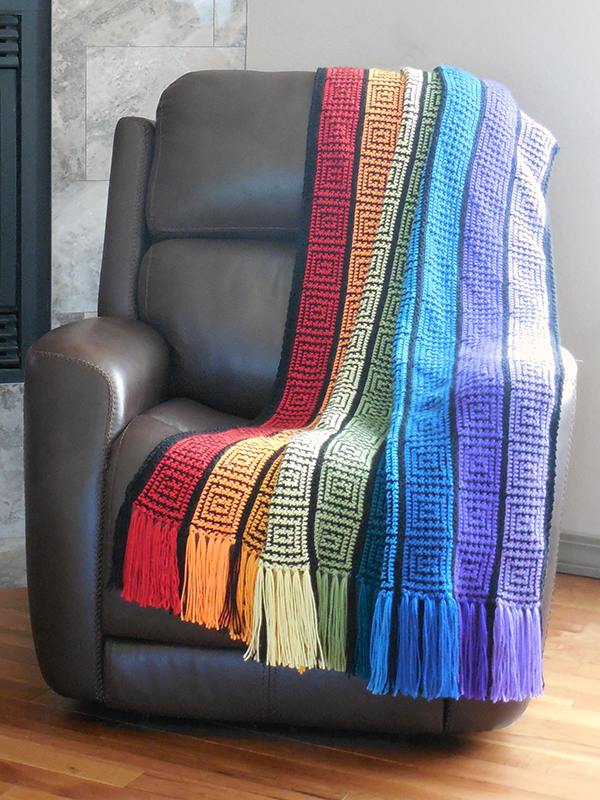 reversible crochet afghan with rainbow stripes