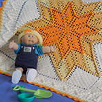 August-themed crochet baby afghan set