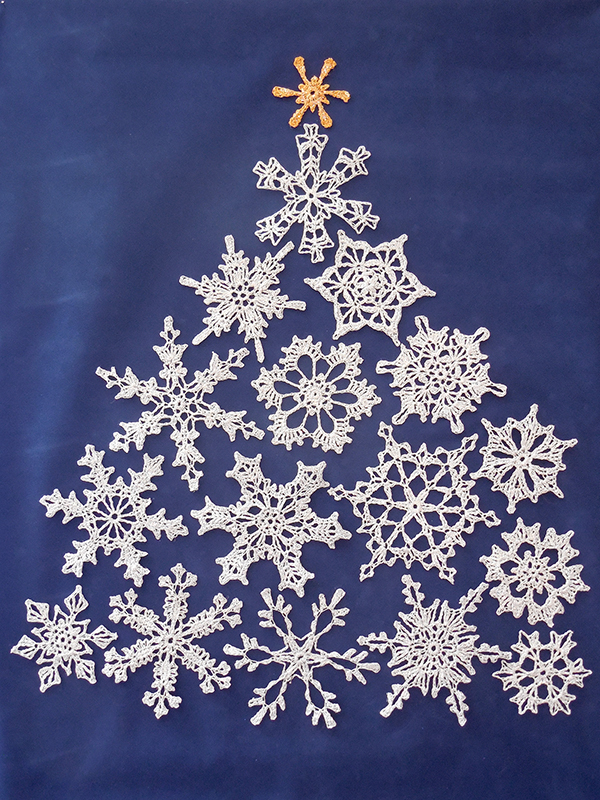 lacy snowflakes shaped into a Christmas tree
