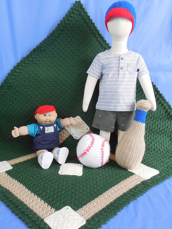 July-themed crochet baby afghan set.