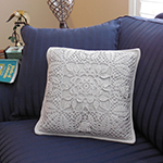 thread crochet pillow with leaf pattern