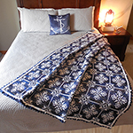 interlocking filet mesh afghan with snowflake design
