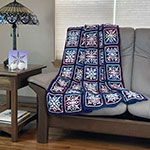 interlocking crochet afghan with snowflake design