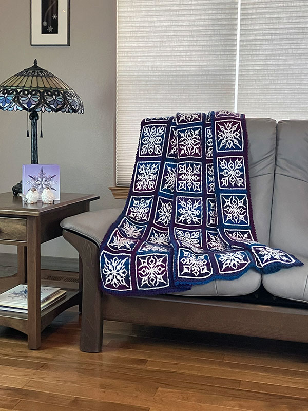 interlocking crochet afghan with snowflake design