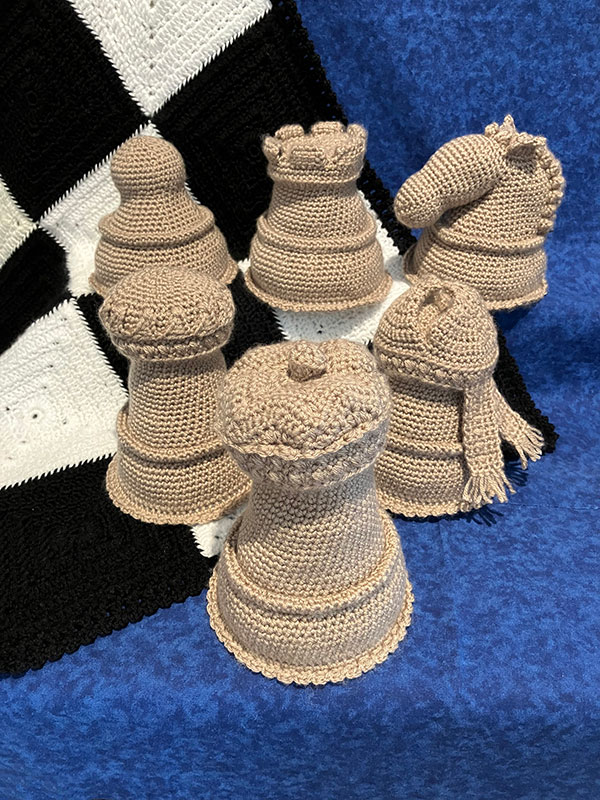 crochet chess set with amigurumi chess pieces and chess board afghan