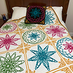 interlocking filet crochet afghan with spirograph-inspired design