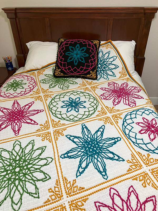 interlocking filet crochet afghan with spirograph-inspired design